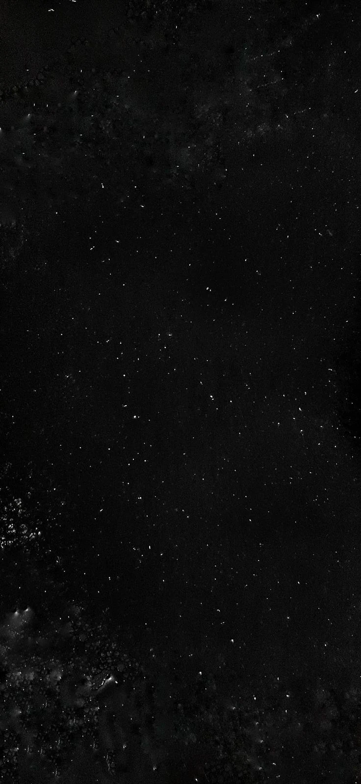 Abstract near-black night sky with faint stars and wisps of cloud, an ultra-narrow vertical crop
